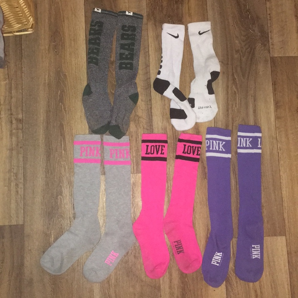 Pink and one nike pair of high socks
